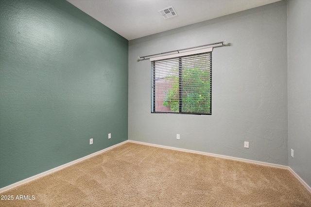 spare room with carpet floors