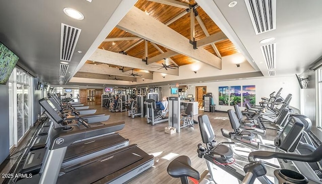 exercise room with hardwood / wood-style flooring, ceiling fan, vaulted ceiling, and wooden ceiling