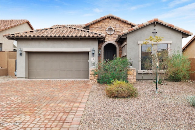 mediterranean / spanish house featuring a garage