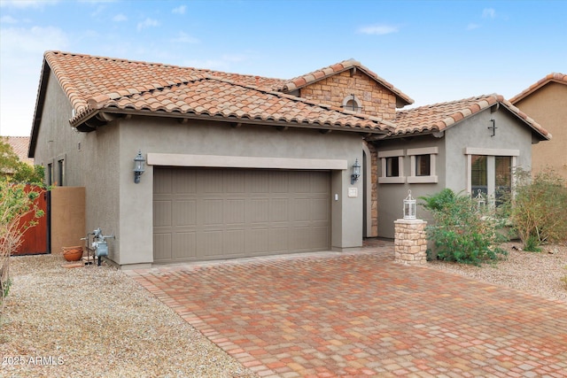 mediterranean / spanish house featuring a garage