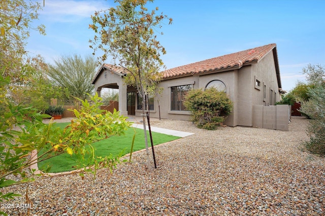 rear view of house featuring a patio