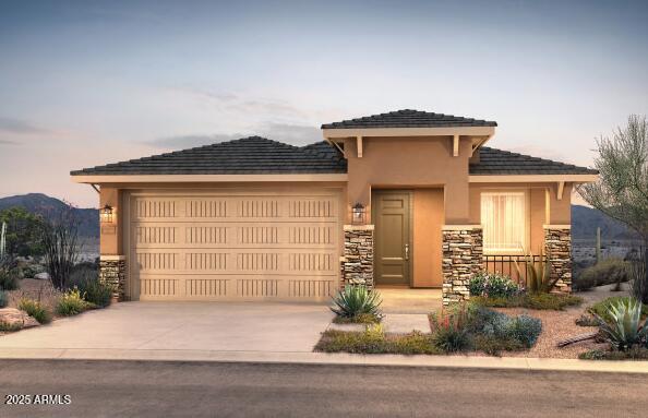 13573 W Cassia Trl, Peoria, AZ 85383 - prairie-style home with stone siding, a garage, and concrete driveway