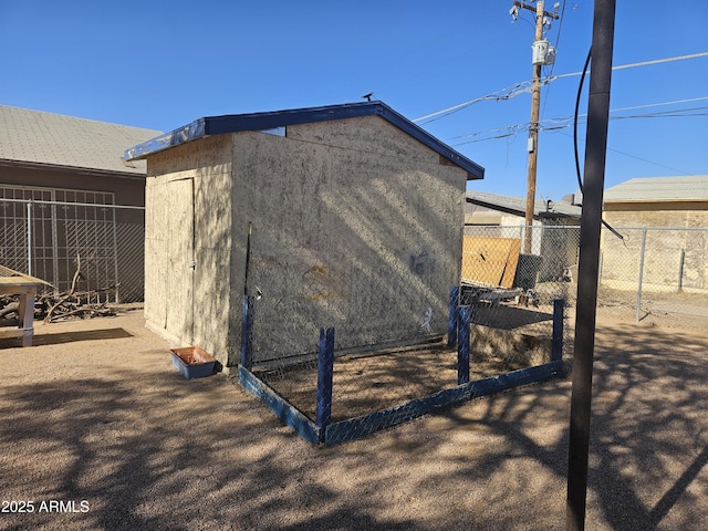 view of property exterior featuring a storage shed