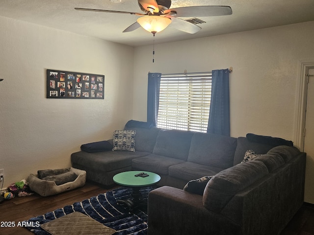 living room with ceiling fan and hardwood / wood-style floors