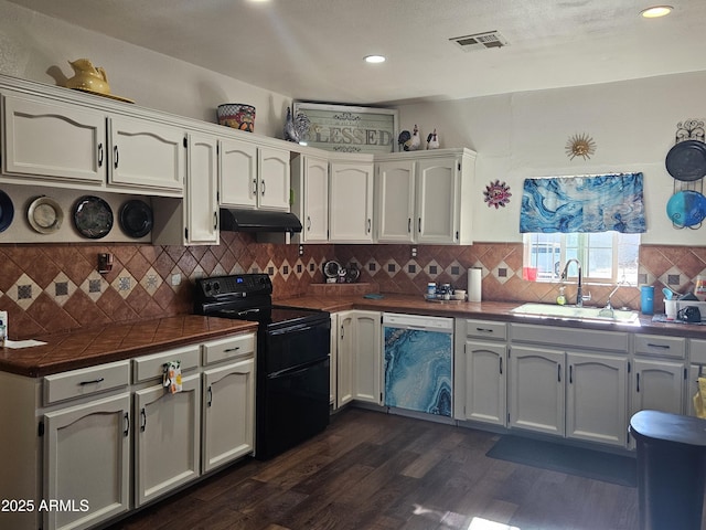 kitchen featuring white cabinetry, dishwasher, black range with electric stovetop, and sink