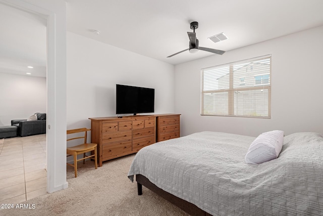 bedroom with light carpet and ceiling fan