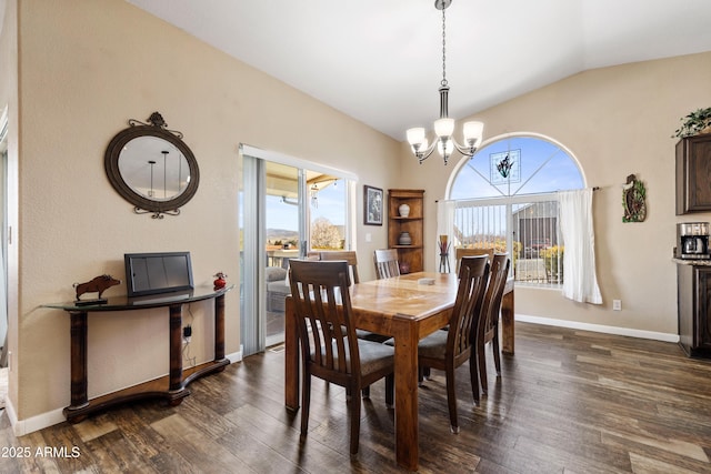 11180 E Navajo Dr, Dewey, AZ 86327 - dining space featuring baseboards, a chandelier, lofted ceiling, and dark wood-type flooring