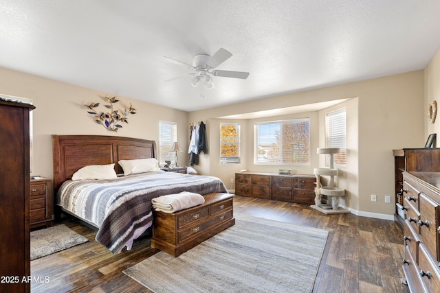 11180 E Navajo Dr, Dewey, AZ 86327 - bedroom with baseboards, a ceiling fan, and dark wood-style flooring