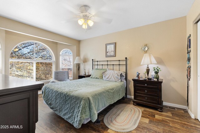 11180 E Navajo Dr, Dewey, AZ 86327 - bedroom featuring baseboards, a ceiling fan, dark wood finished floors, and visible vents