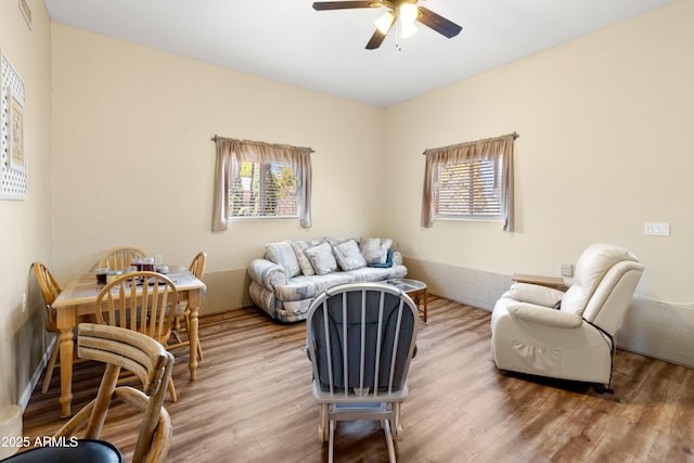 11180 E Navajo Dr, Dewey, AZ 86327 - living area featuring visible vents, ceiling fan, wood finished floors, and a wealth of natural light