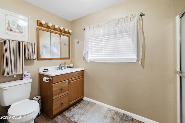 11180 E Navajo Dr, Dewey, AZ 86327 - bathroom with toilet, baseboards, wood finished floors, and vanity