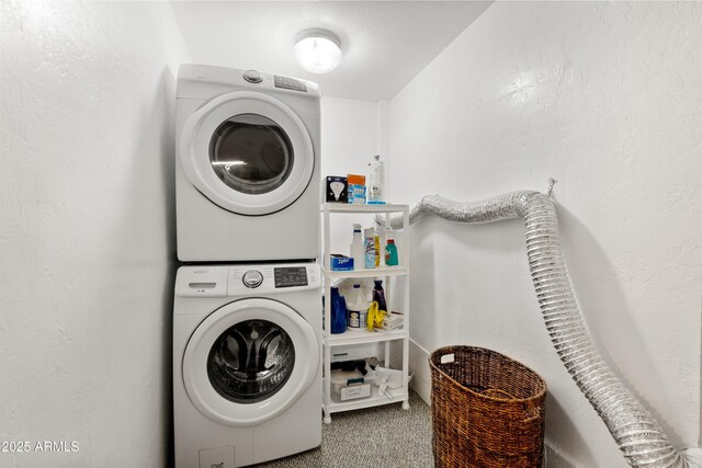 11180 E Navajo Dr, Dewey, AZ 86327 - clothes washing area featuring laundry area, stacked washing maching and dryer, and carpet floors