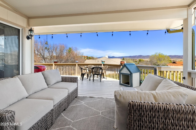 11180 E Navajo Dr, Dewey, AZ 86327 - deck with an outdoor living space, a mountain view, and outdoor dining space