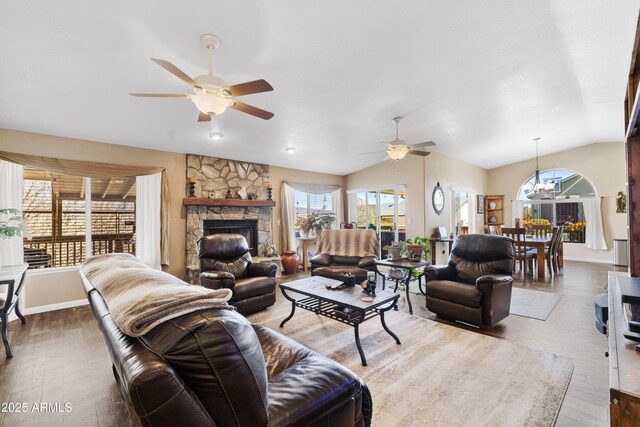11180 E Navajo Dr, Dewey, AZ 86327 - living room featuring ceiling fan with notable chandelier, wood finished floors, and a wealth of natural light