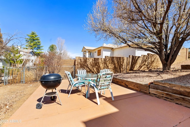 11180 E Navajo Dr, Dewey, AZ 86327 - view of patio / terrace with a fenced backyard, outdoor dining space, and a grill