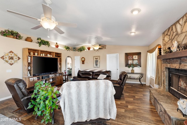 11180 E Navajo Dr, Dewey, AZ 86327 - living room featuring lofted ceiling, baseboards, a stone fireplace, dark wood-type flooring, and a ceiling fan