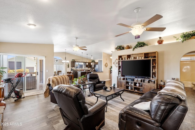 11180 E Navajo Dr, Dewey, AZ 86327 - living area featuring vaulted ceiling, a ceiling fan, wood finished floors, and a healthy amount of sunlight