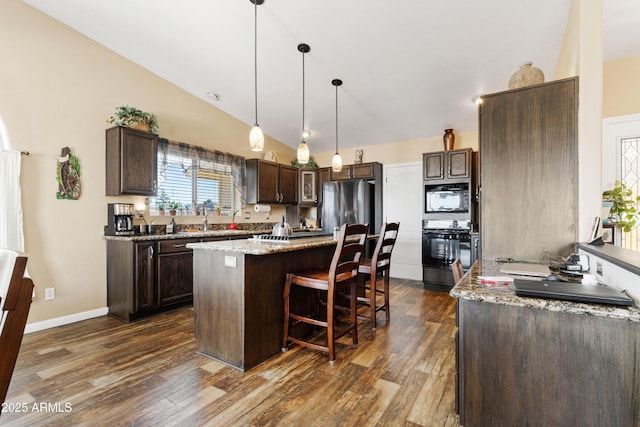 11180 E Navajo Dr, Dewey, AZ 86327 - kitchen featuring dark brown cabinetry, black appliances, dark wood-type flooring, and lofted ceiling