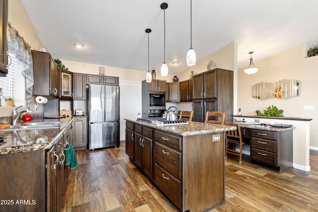 11180 E Navajo Dr, Dewey, AZ 86327 - kitchen with stainless steel appliances, dark wood-style floors, a sink, and a center island