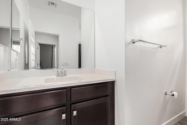 bathroom featuring visible vents and vanity