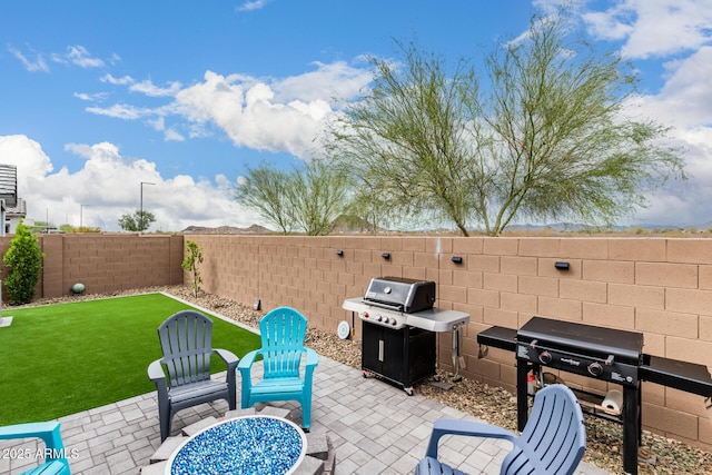 view of patio / terrace featuring area for grilling and a fenced backyard