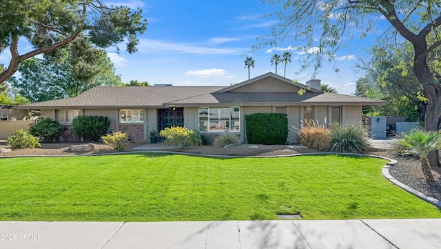 single story home with a front yard
