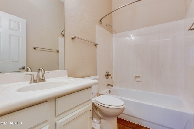 6970 W Paso Trl, Peoria, AZ 85383 - full bathroom featuring toilet, wood finished floors, vanity, and shower / bathing tub combination
