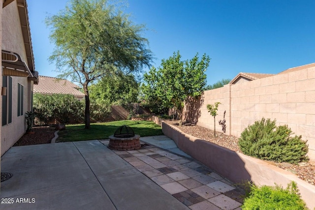 6970 W Paso Trl, Peoria, AZ 85383 - view of patio with an outdoor fire pit and a fenced backyard