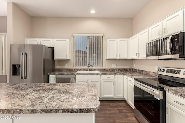 6970 W Paso Trl, Peoria, AZ 85383 - kitchen featuring recessed lighting, white cabinetry, stainless steel appliances, a sink, and dark wood-style floors