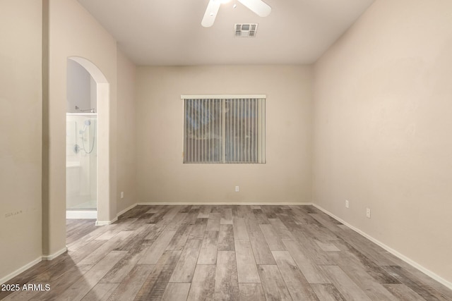 6970 W Paso Trl, Peoria, AZ 85383 - unfurnished room featuring baseboards, visible vents, wood finished floors, and ceiling fan