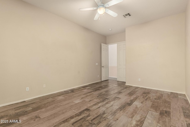 6970 W Paso Trl, Peoria, AZ 85383 - unfurnished room with a ceiling fan, visible vents, wood finished floors, and baseboards