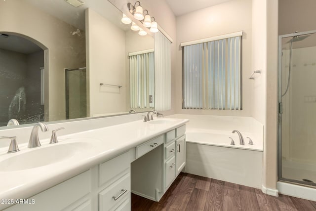6970 W Paso Trl, Peoria, AZ 85383 - full bath with wood finished floors, a shower stall, double vanity, and a sink