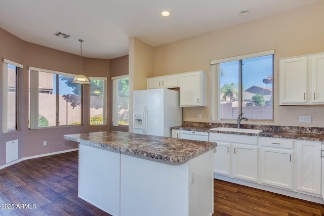 6970 W Paso Trl, Peoria, AZ 85383 - kitchen with white cabinetry, a sink, visible vents, dark wood-style flooring, and white appliances