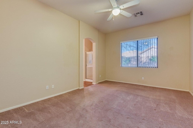 6970 W Paso Trl, Peoria, AZ 85383 - carpeted spare room featuring visible vents, a ceiling fan, baseboards, and arched walkways
