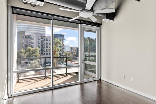 empty room with wood-type flooring and ceiling fan