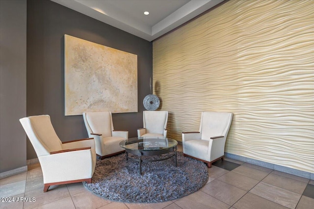 sitting room with tile patterned floors