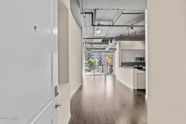 hall with hardwood / wood-style flooring