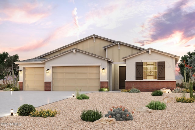17770 W Fulton St, Goodyear, AZ 85338 - view of front of home with brick siding, an attached garage, concrete driveway, and board and batten siding