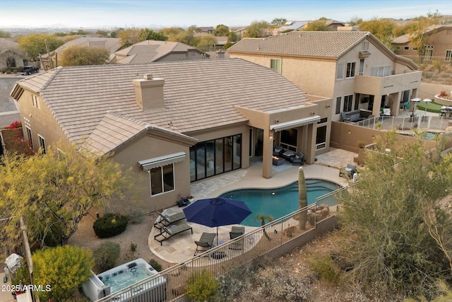 back of property featuring a fenced in pool, central AC unit, and a patio