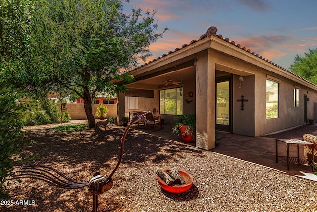 7617 E Desert Honeysuckle Dr, Gold Canyon, AZ 85118 - rear view of house with a ceiling fan, stucco siding, and a patio