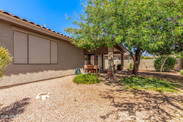 7617 E Desert Honeysuckle Dr, Gold Canyon, AZ 85118 - back of property with stucco siding and a patio area