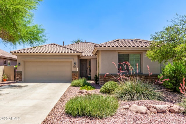 7617 E Desert Honeysuckle Dr, Gold Canyon, AZ 85118 - mediterranean / spanish home with stucco siding, an attached garage, concrete driveway, and a tiled roof
