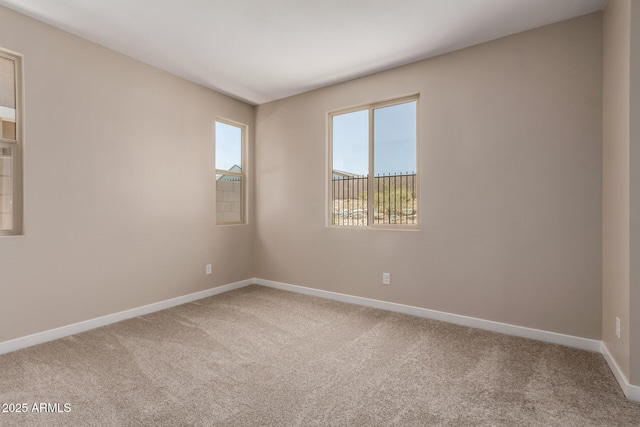 5656 N 205th Ln, Buckeye, AZ 85396 - empty room featuring carpet floors and baseboards
