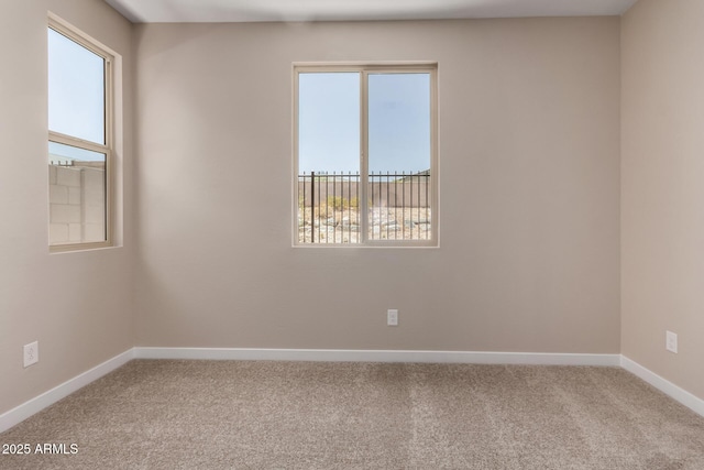 5656 N 205th Ln, Buckeye, AZ 85396 - carpeted spare room with plenty of natural light and baseboards