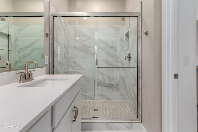 5656 N 205th Ln, Buckeye, AZ 85396 - bathroom with vanity, marble finish flooring, a stall shower, and baseboards