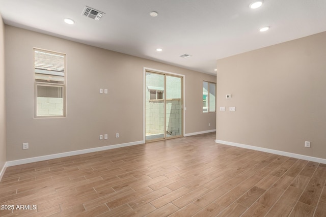 5656 N 205th Ln, Buckeye, AZ 85396 - spare room with light wood-style flooring, baseboards, and recessed lighting