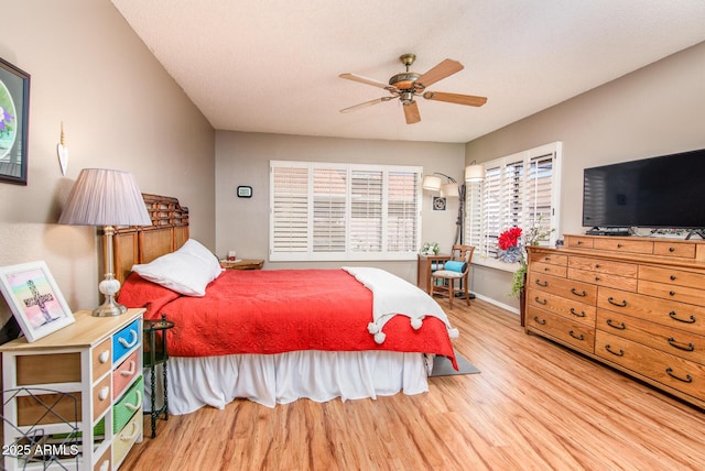 bedroom with wood finished floors and a ceiling fan