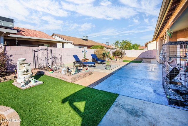 view of pool with a yard, a patio, and a fenced backyard