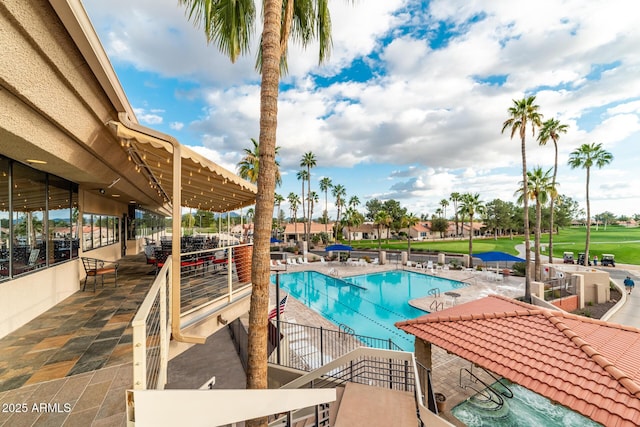 community pool with a patio