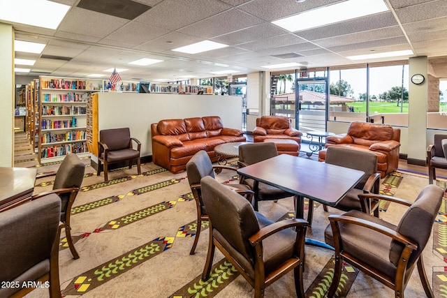 interior space featuring a drop ceiling